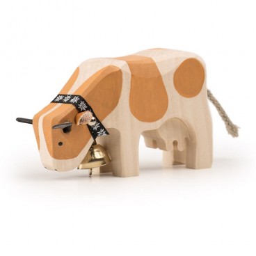 Trauffer Holzkuh fressend Simmental