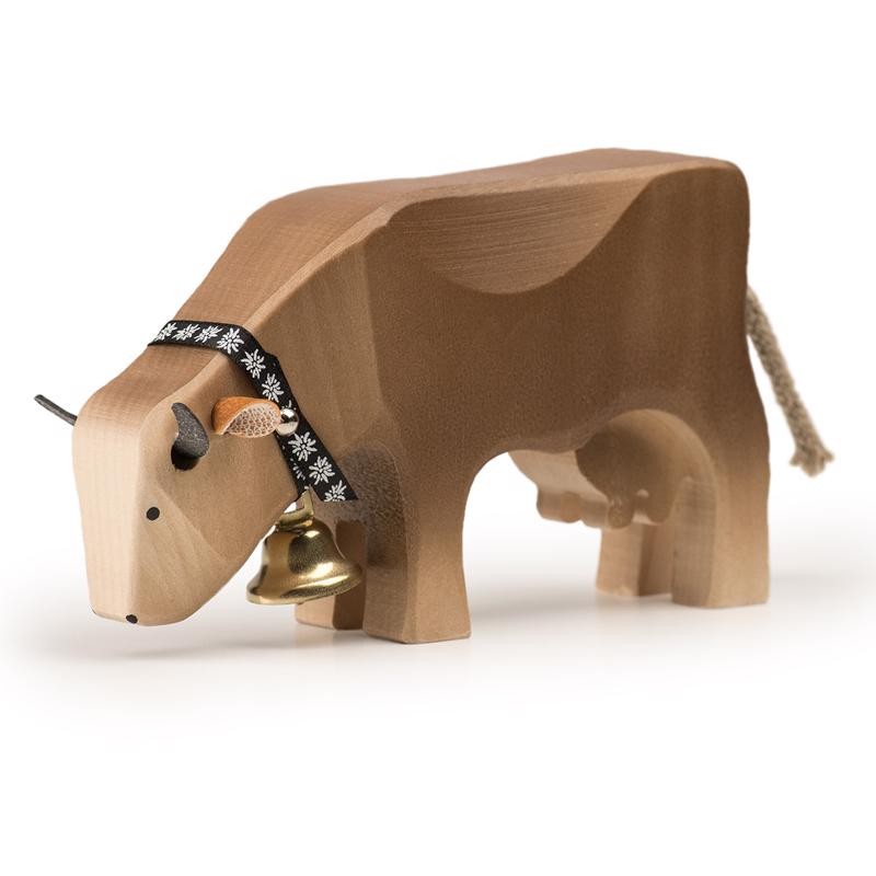 Trauffer Holzkuh fressend Braunvieh Trauffer Holzkuh fressend Braunvieh