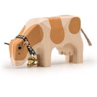 Trauffer Holzkuh fressend Simmental
